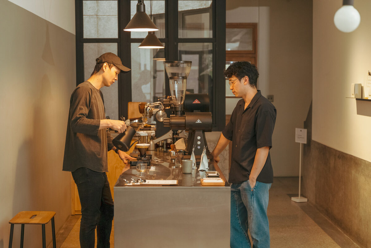 Barista brewing coffee at specialty coffee shop Pharos Coffee in Taiwan