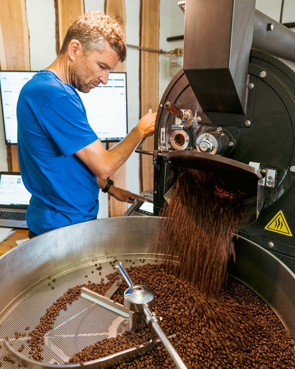 Christoph Sauser, cyclist and specialty coffee roaster, roasting specialty coffee at HORIZONTE COFFEE ROASTERS in Leysin, Switzerland