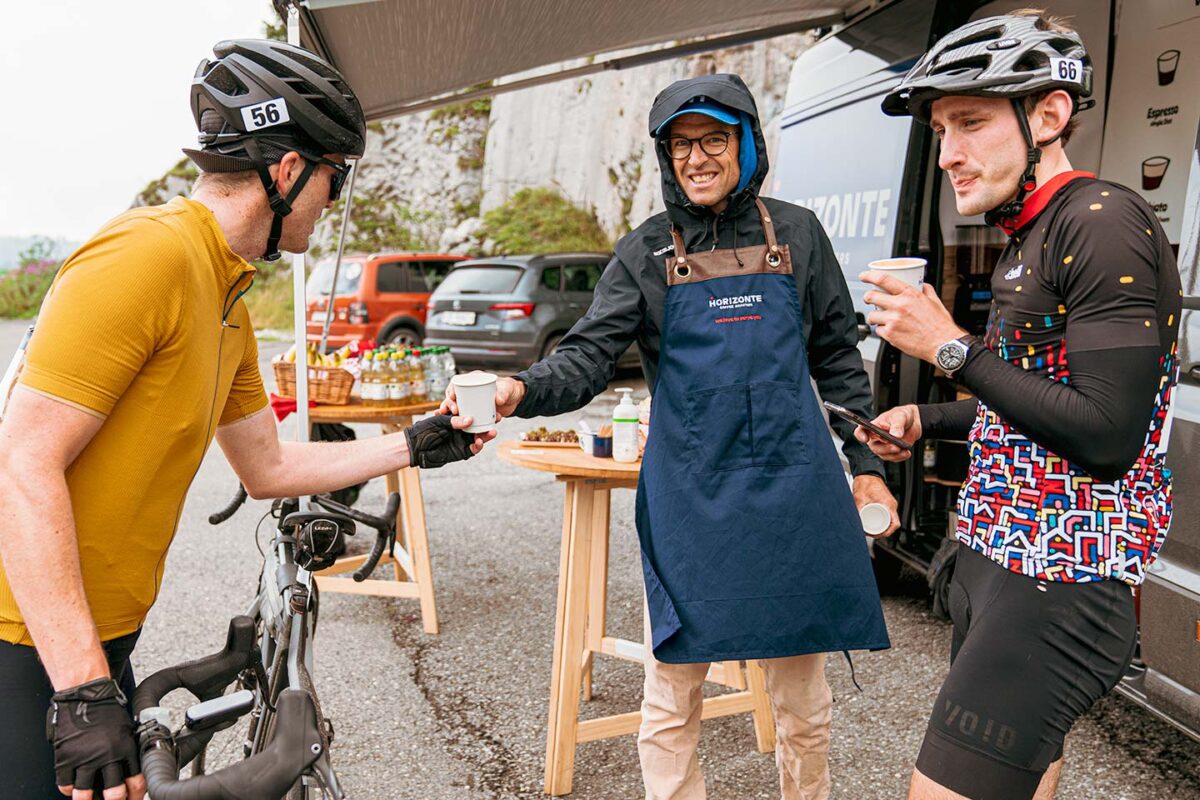 Christoph Sauser serving specialty coffee to fellow cyclists in Leysin, Switzerland