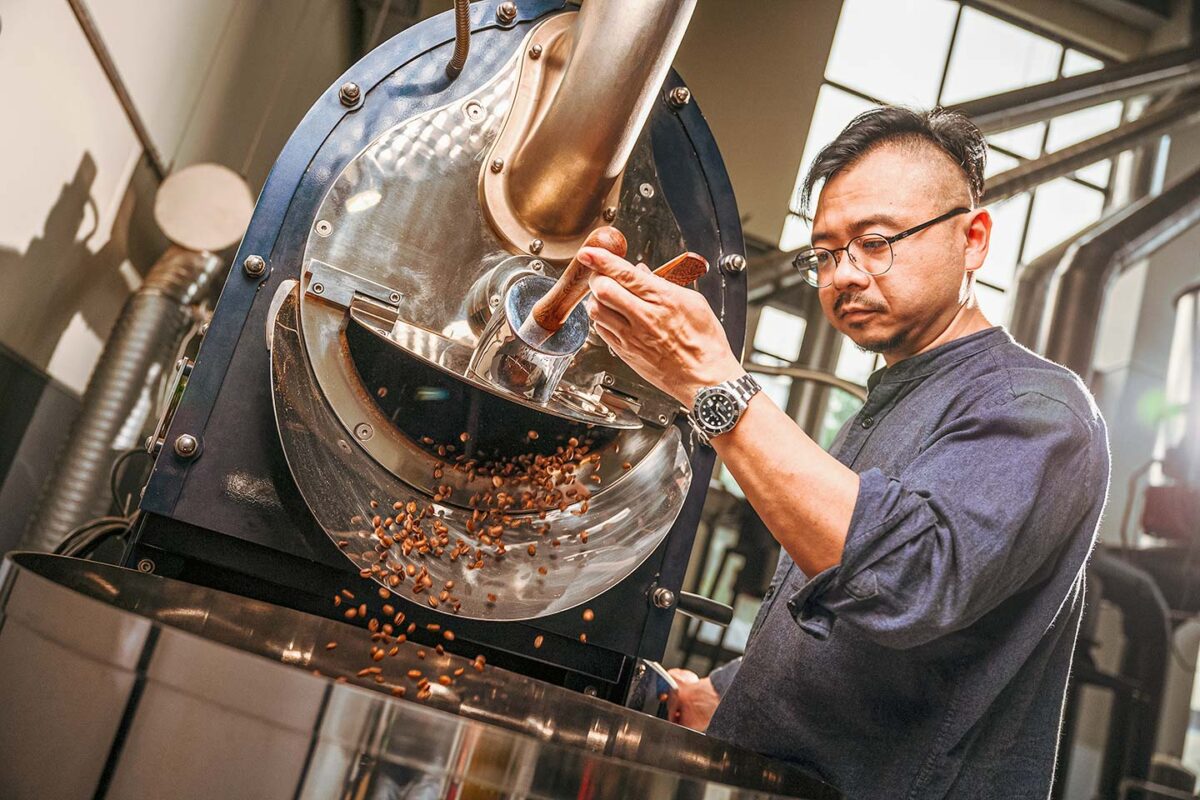 Jacky Lai roasting beans at Coffee Bullet, a specialty coffee roastery and cafe in Kaohsiung, Taiwan