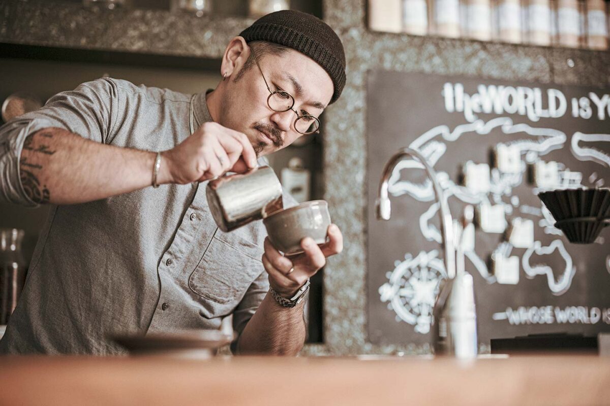 Kazuo Yoshida making latte art at his specialty coffee shop Life Size Cribe in Tokyo's Kokubunji area