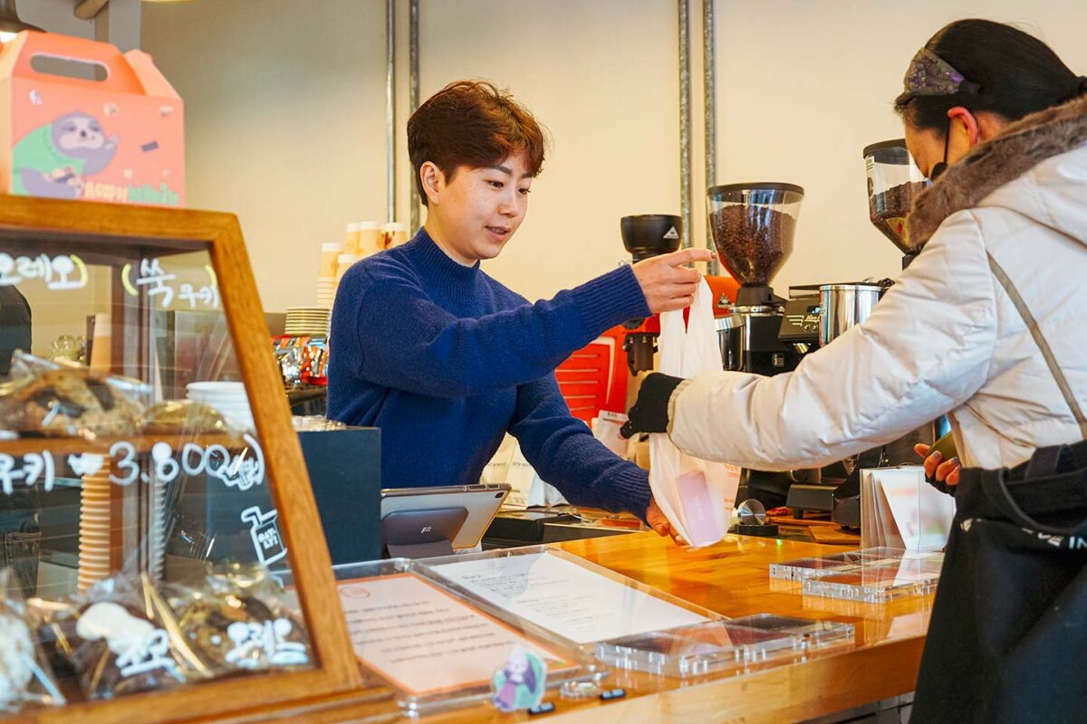 Serving customers at New Wave Coffee Roasters, a specialty coffee roaster in Seoul, South Korea