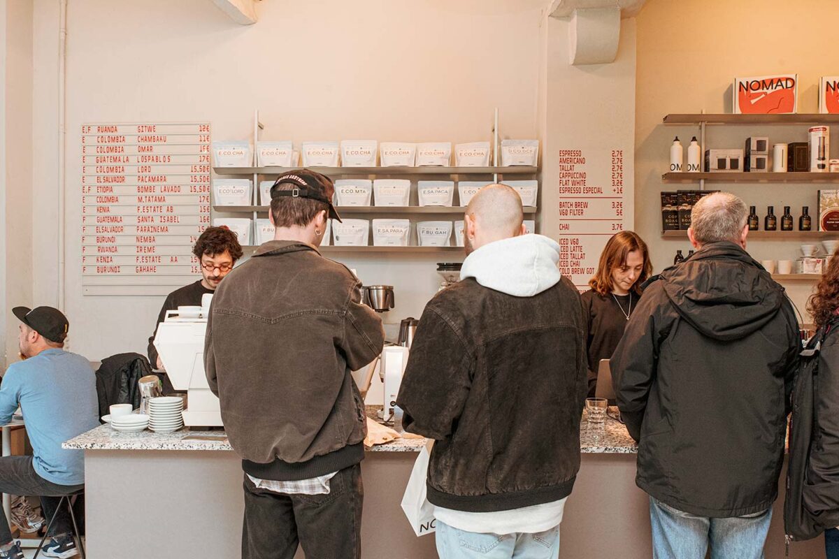 Customers lining up to buy specialty coffee at NOMAD in Barcelona