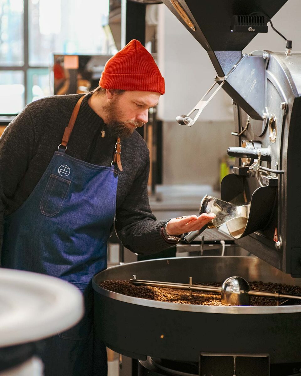 Martin Beniak roasting beans at Triple Five Coffee, a specialty coffee roastery in Slovakia